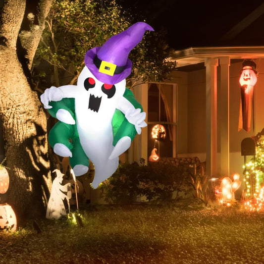 Inflatable Halloween ghost with glowing LED face, purple hat and green outfit outdoors