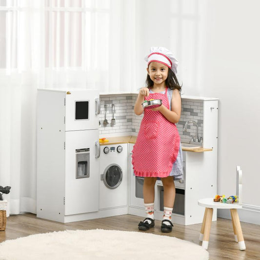 Kids play kitchen set in white with opening doors and sink area, with a child wearing a hat