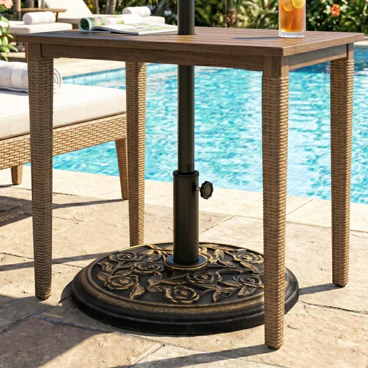 Umbrella base stand with black pole and bronze rose floral round base on patio