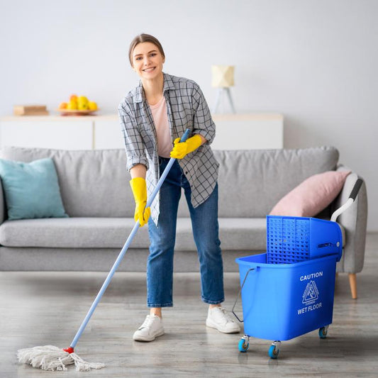 Blue wheeled mop bucket with wringer and mop wringing basket beside a cleaning mop