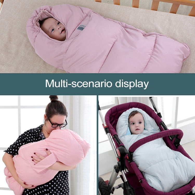 Light pink baby sleeping bag with hood and side zipper edge visible