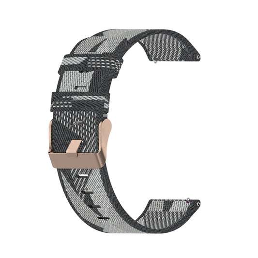 Grey striped nylon watch band with metal buckle on curved strap.