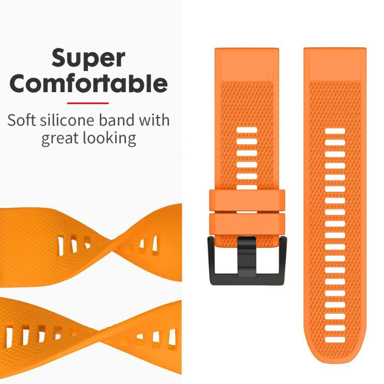 Orange silicone watch band detail with textured strap and quick-release buckle