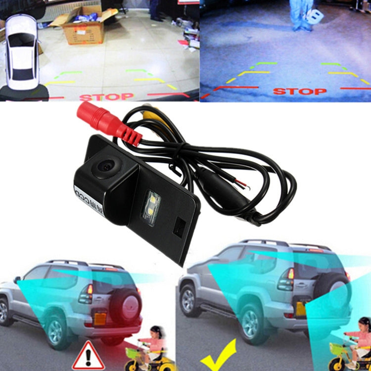 Rear view parking camera with red wiring connected to a compact black mounting bracket