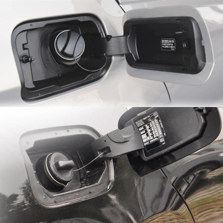 Installed fuel tank cap showing black cover and latch area around the fuel opening