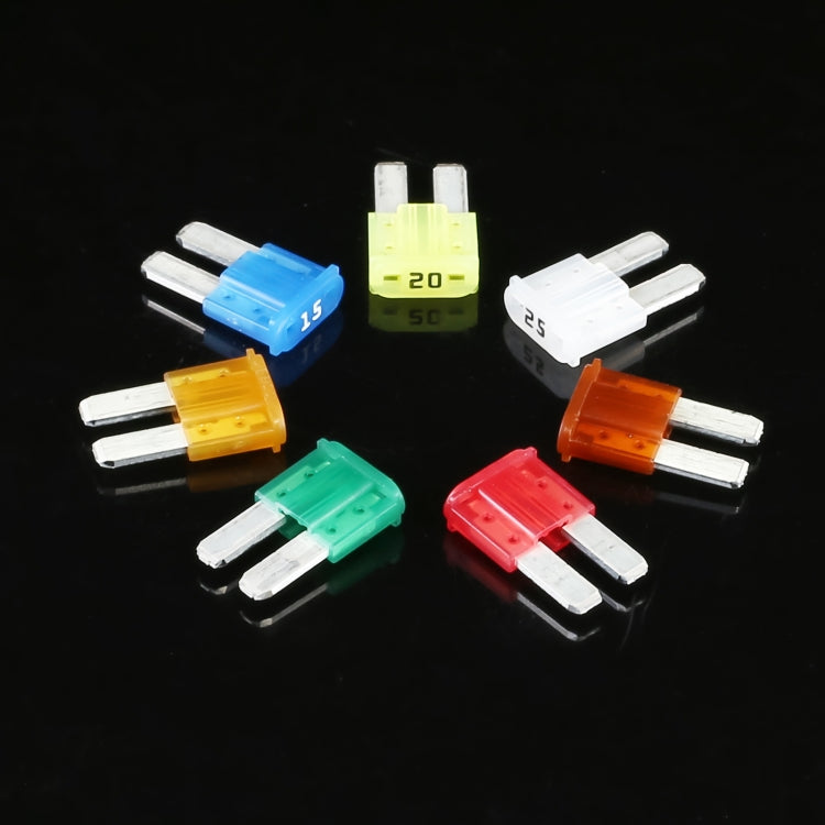 Assorted mini blade fuses with white bases in blue, yellow, white, orange, green, red