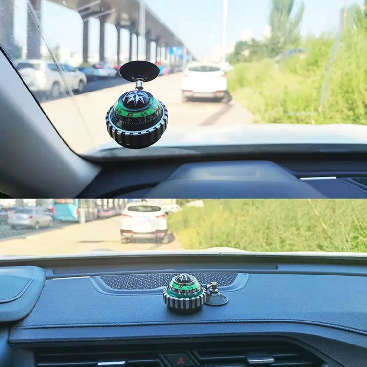 Ball compass on car dashboard with suction cup, green dial