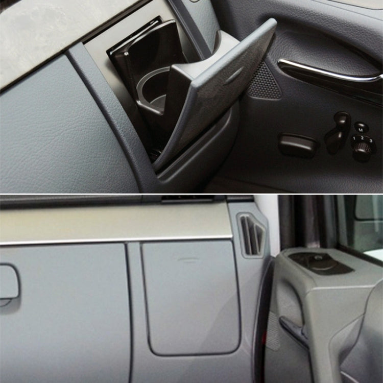 Installed co-driver dashboard cup holder with cover open and circular cup well visible