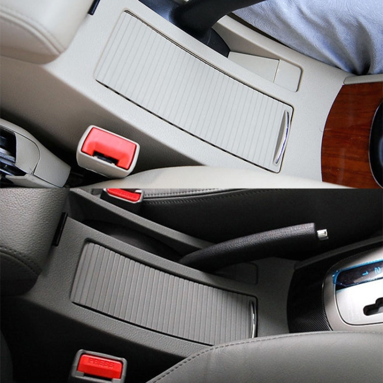 Black ribbed cup holder cover insert fitted on car center console