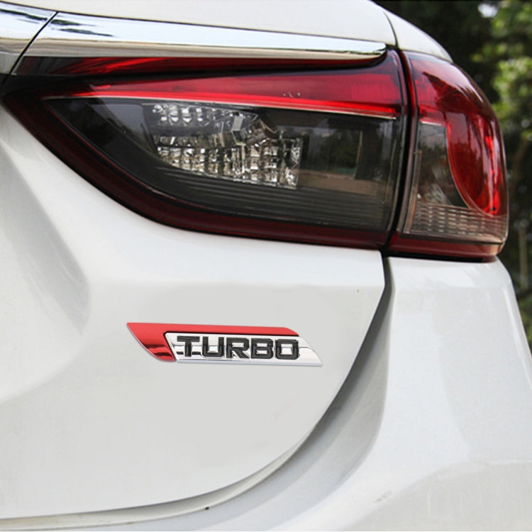 Car rear badge sticker with red “TURBO” emblem on chrome trim