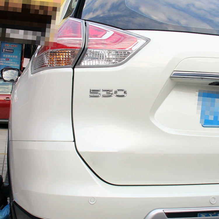 Car body “530” chrome number sticker on the rear panel