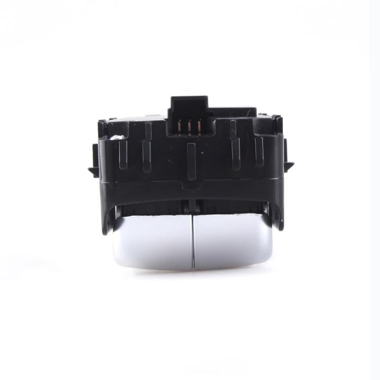 Power window switch assembly side view with silver rocker and black plastic frame