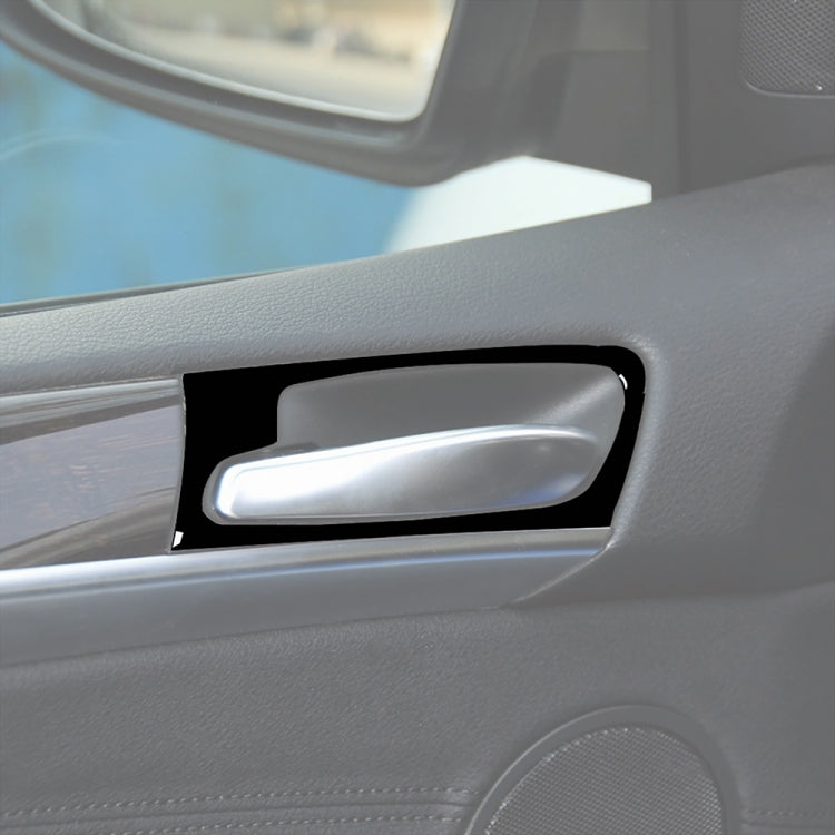 Installed door handle decorative sticker: black frame around chrome-like insert