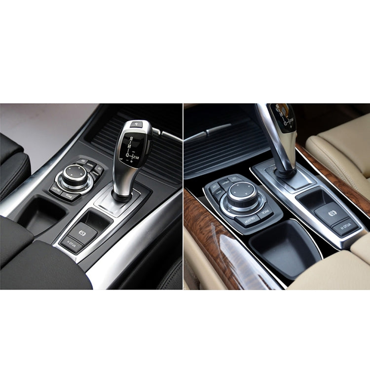 Before-and-after gear panel sticker: black overlay updates center console controls area