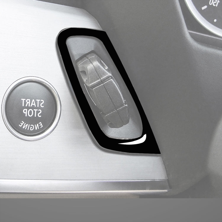 Gray keyhole insert with black border decorative sticker trim for car console