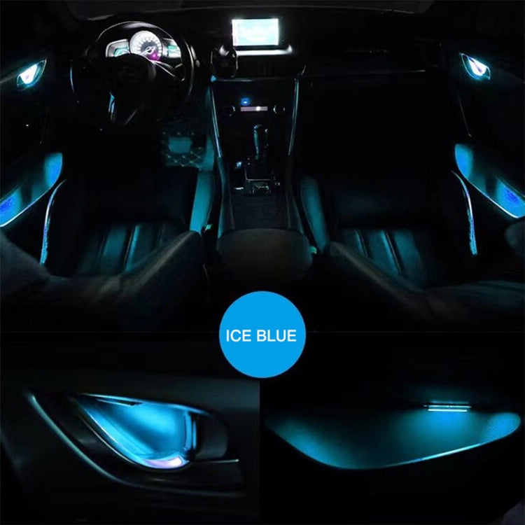 Car door LED ambient lights glowing ice blue around door panels and interior footwell.