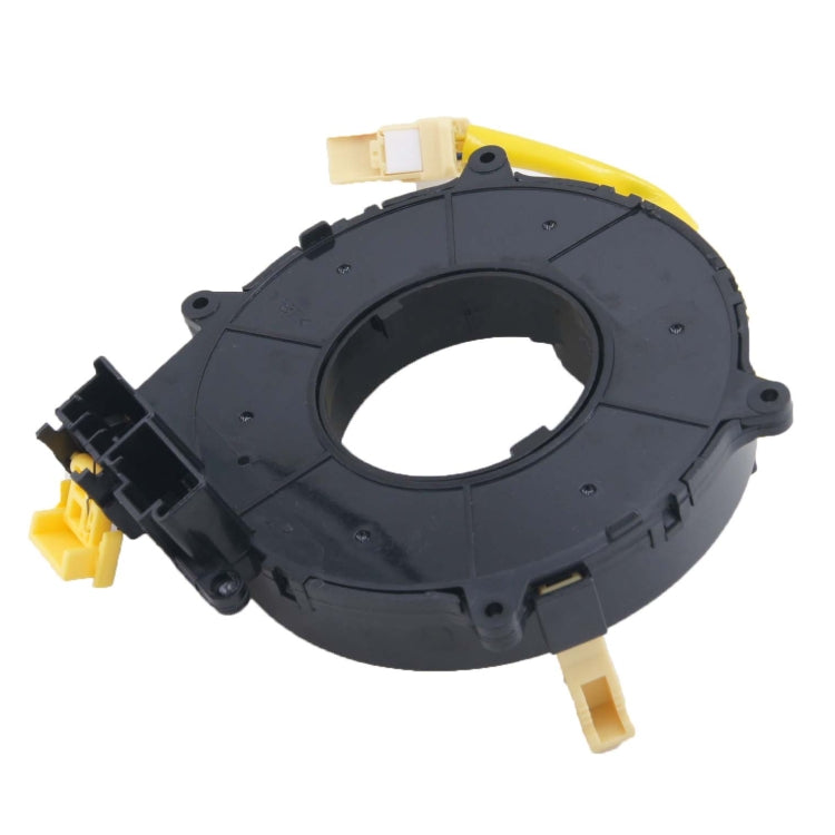 Black clock spring with yellow wire pigtails and beige plastic connector housings