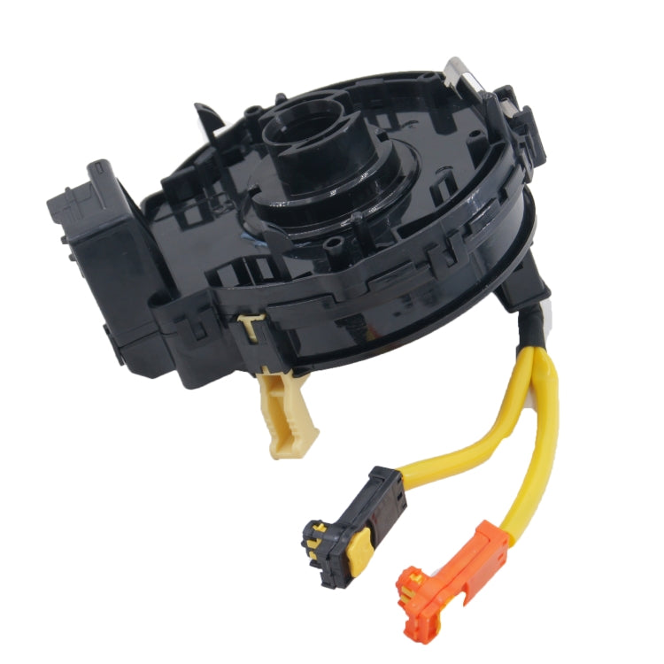 Clock spring with black housing and yellow wiring, multiple electrical plugs