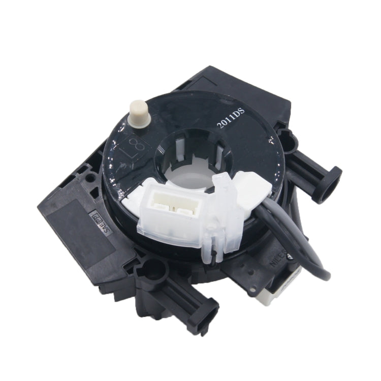 Clock spring contact coil with black housing, white connector, integrated lever arm
