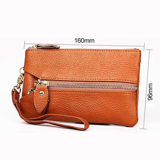Orange litchi-texture wallet clutch with detachable wrist strap and dual zip openings