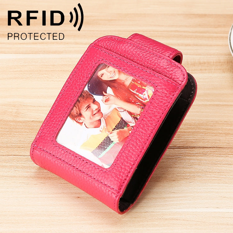Pink leather vertical wallet with clear ID window and multiple card slots