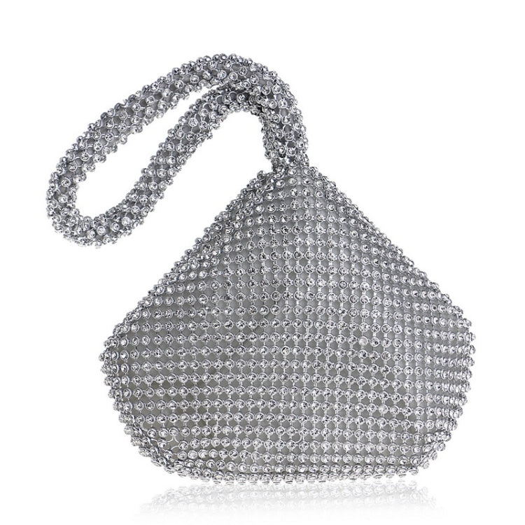 Silver rhinestone evening handbag with top handle and shimmering beaded surface