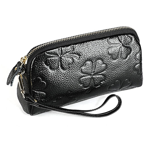 Black litchi-texture zip wristlet wallet with embossed clover design and wrist strap