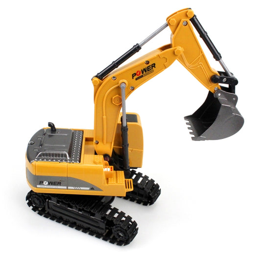 Yellow metal RC excavator with gray bucket and black arm supports; side view