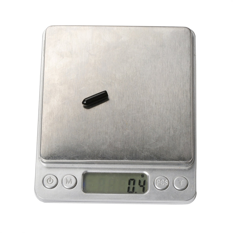 Black antenna protection cap sleeve on a digital scale