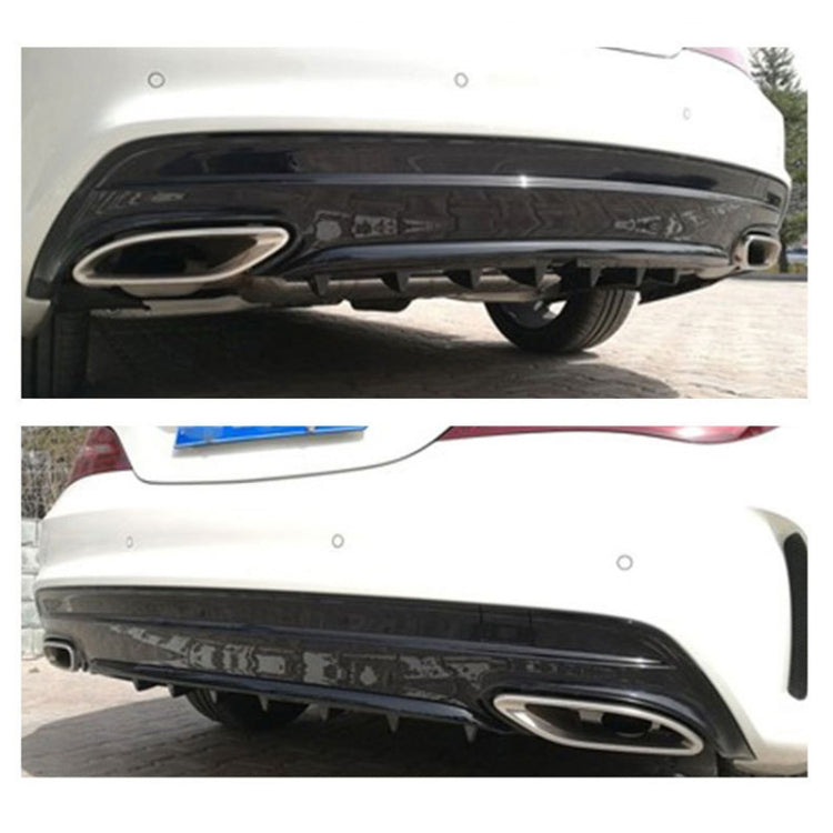 Black shark-fin style rear bumper lip diffuser installed under the rear bumper