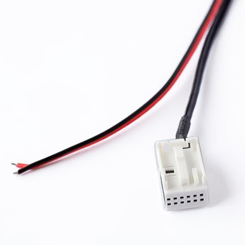 Car audio adapter cable close-up: black and red wires with white multi-pin connector