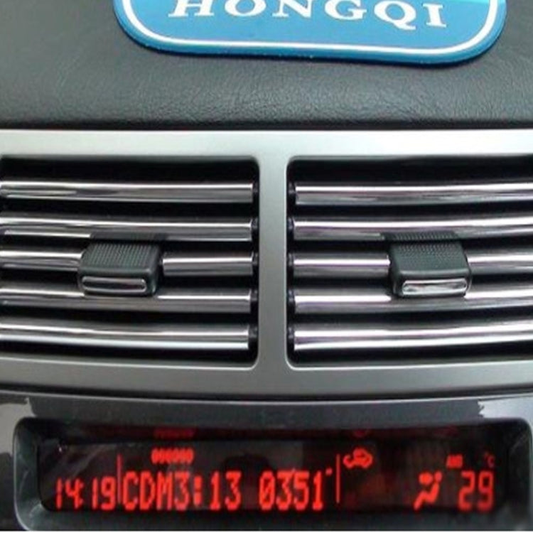 Chrome vent trim installed in car air vent openings on the dashboard