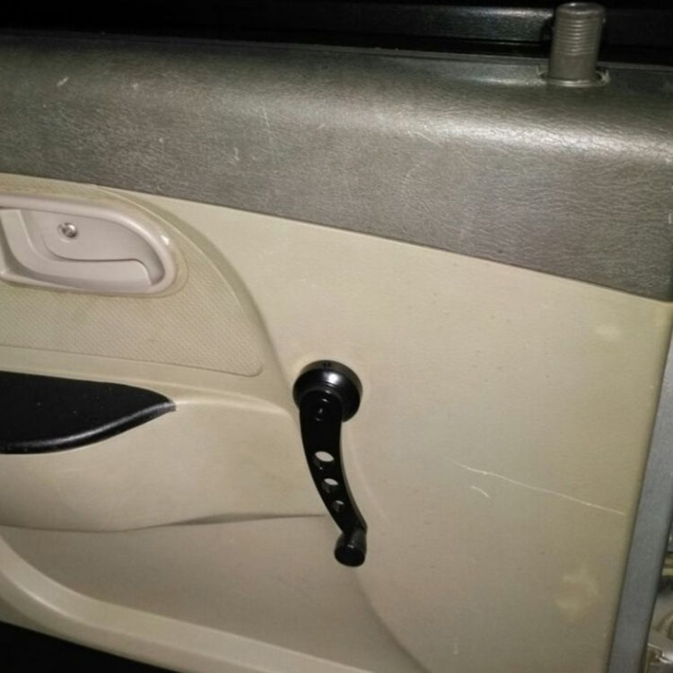 Black manual window crank handle installed on a car door