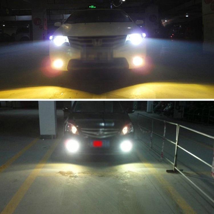 Car with bright HID xenon headlights shining down on the road in a garage