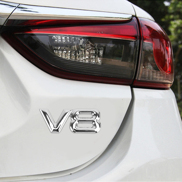 Silver V8 car body decorative sticker on vehicle rear panel, chrome letters with cutouts