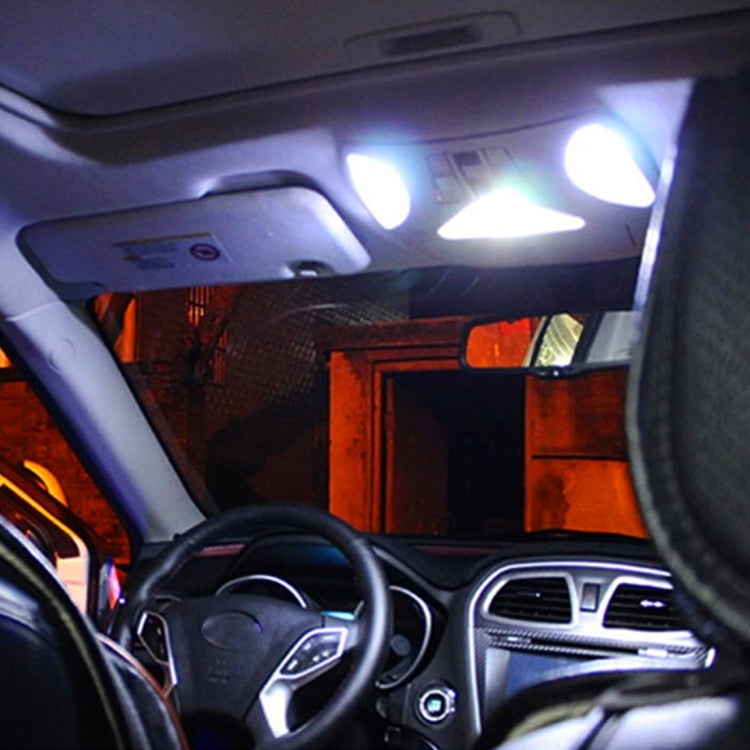Car cabin with dome reading lights on, bright LED glow near the overhead console