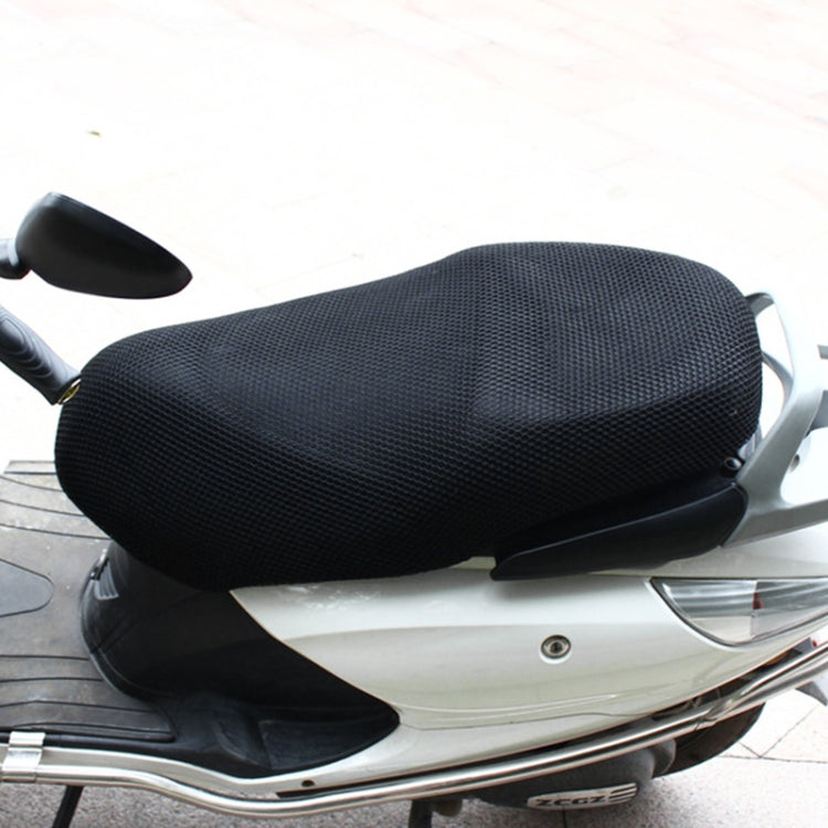 Motorcycle seat cushion in black honeycomb mesh fitted on a scooter seat