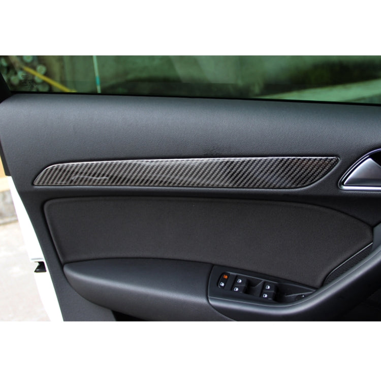 Installed carbon fiber door panel trim sticker strips on car interior door panel