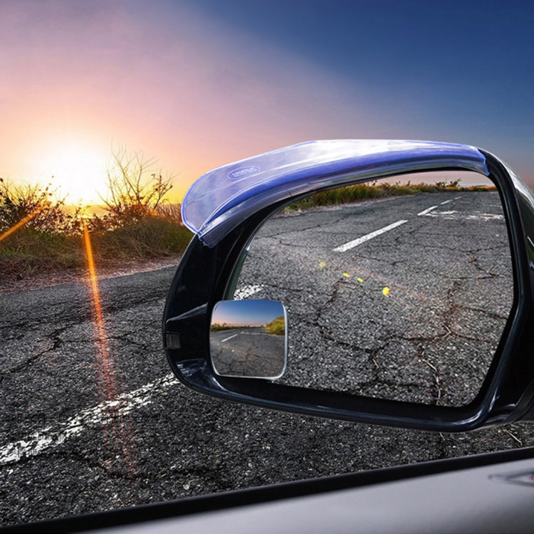 Car blind spot rear view mirror with blue-tinted wide-angle lens in black housing