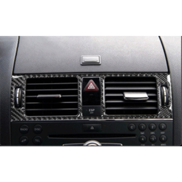 Installed carbon fiber dashboard vent trim frame around air vents and hazard center