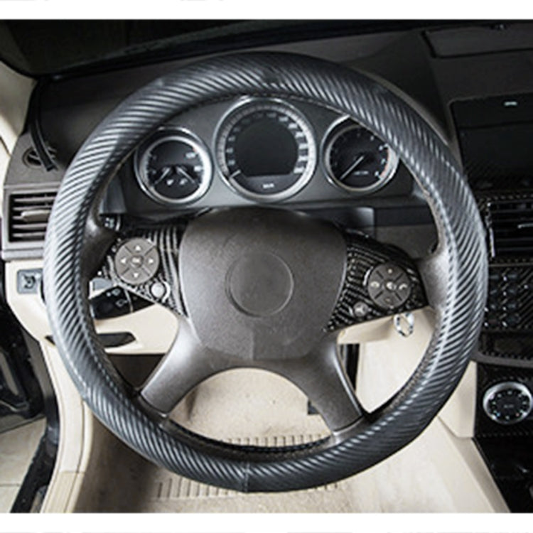 Carbon fiber-look steering wheel cover with control button sticker details