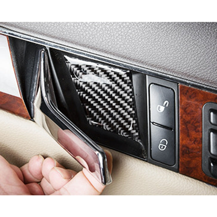 Door inner handle wrist panel carbon fiber trim sticker installed, hand pressing into place