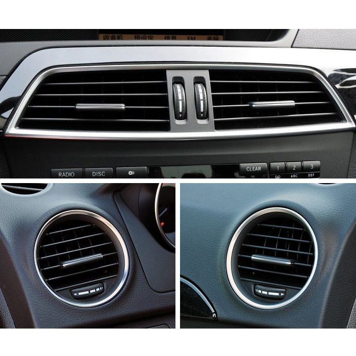Car dashboard air vent with chrome ring and vent control tab