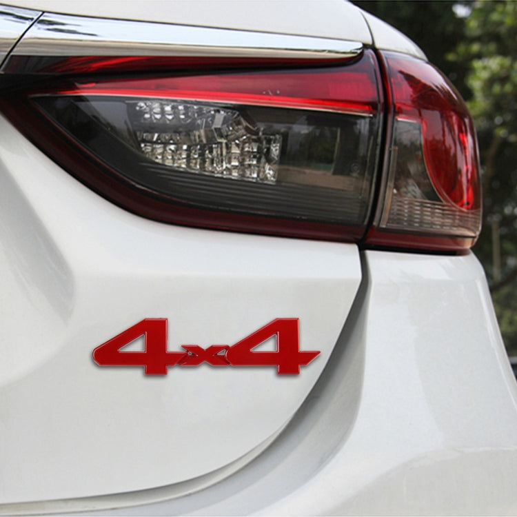 4x4 car emblem sticker on white rear bumper, red emblem with silver trim