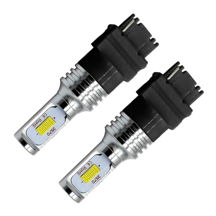 Pair of LED backup bulbs with black base and silver metal housing, 3156 style