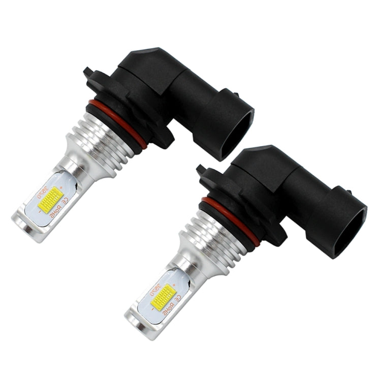 Pair of 9005/HB3 LED fog light bulbs with black base and clear lens