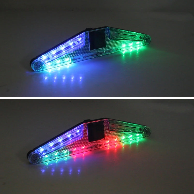Solar warning lamp LED lights glowing blue, green, and red with black center solar panel