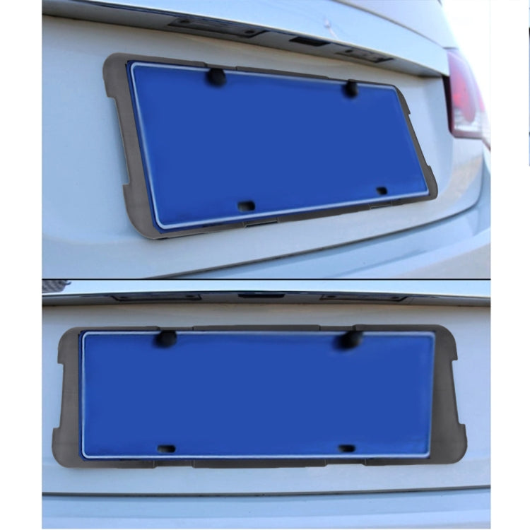 Black license plate frame bracket installed on a car, holding a blue license plate.