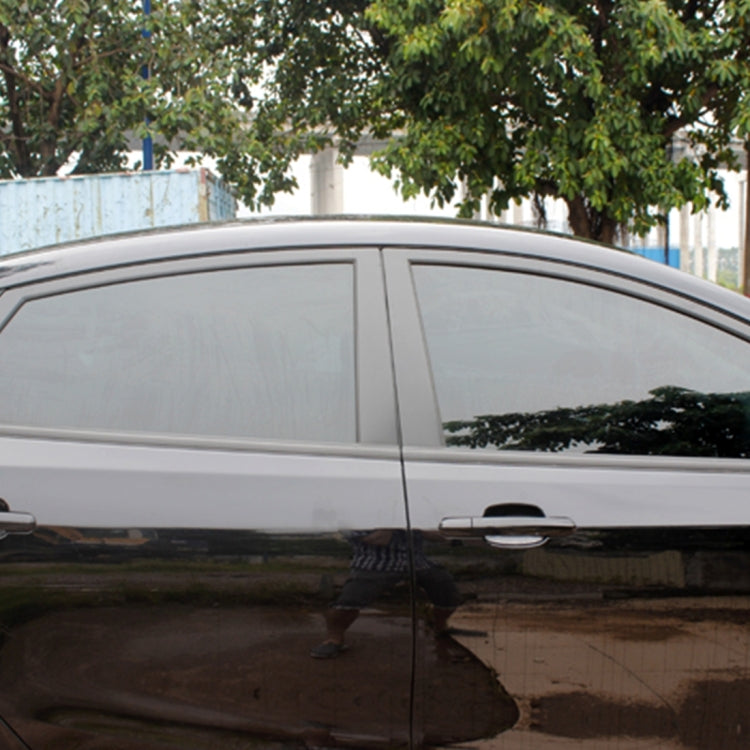 Aumo-mate car window tint film on side window, dark reflective chameleon look