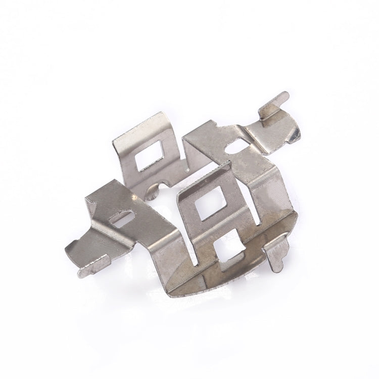 Headlight bulb base retainer adapter close-up, stamped metal retaining clips